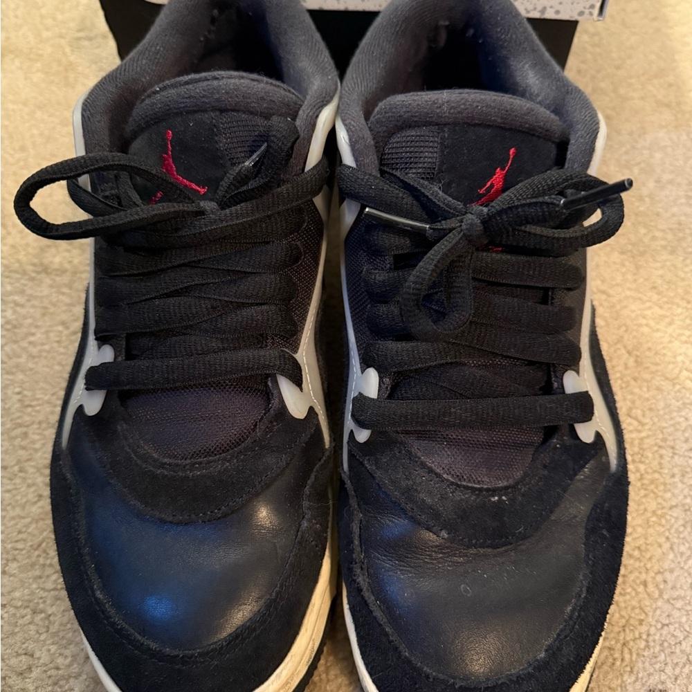 Nike Air Jordan 4RM Black and White Sneakers with Red Accents